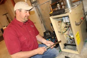 Kurt Zentner & Sons Plumbing & Heating technician making a repair