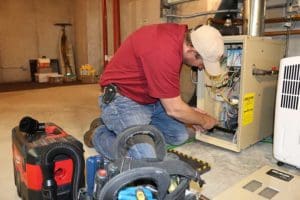 Kurt Zentner & Sons Plumbing & Heating repairing a boiler