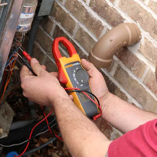 Kurt Zentner & Sons Plumbing & Heating technician checking a pipe